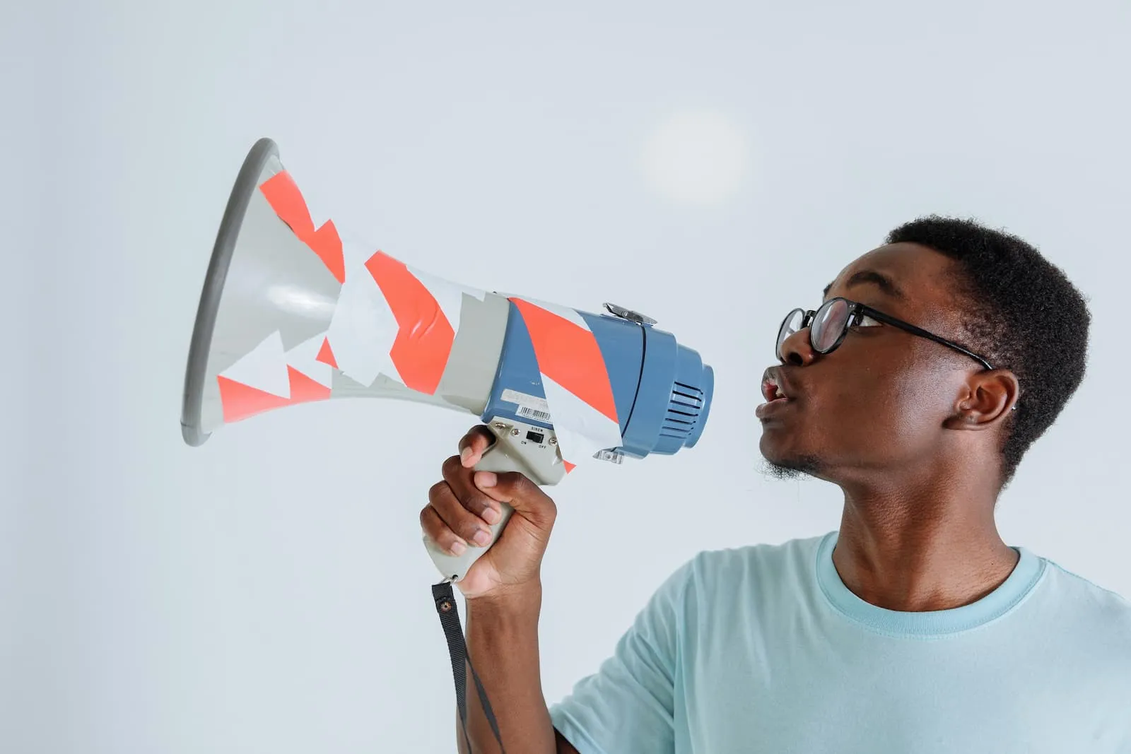 A man speaking into a megaphone.