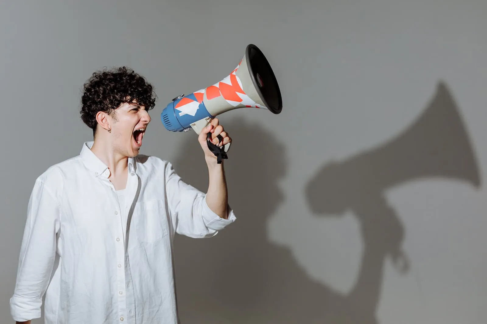 Man speaking into a megaphone.