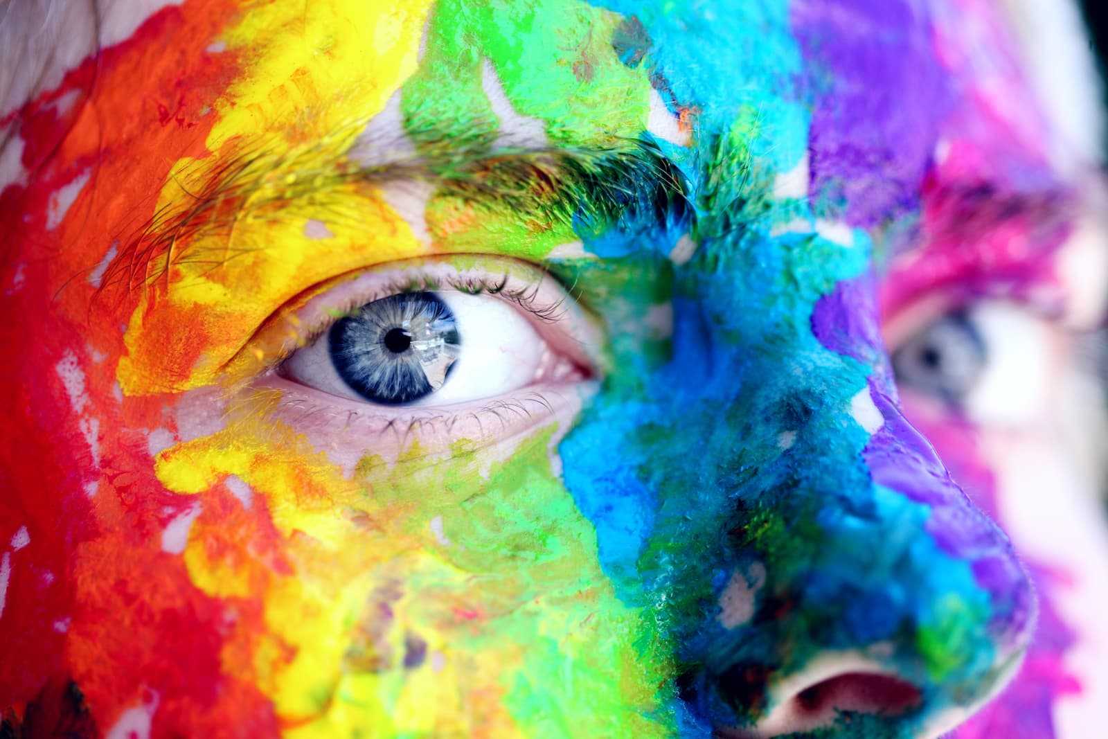 Colourfully painted face. As colourful as the live of a web developer.