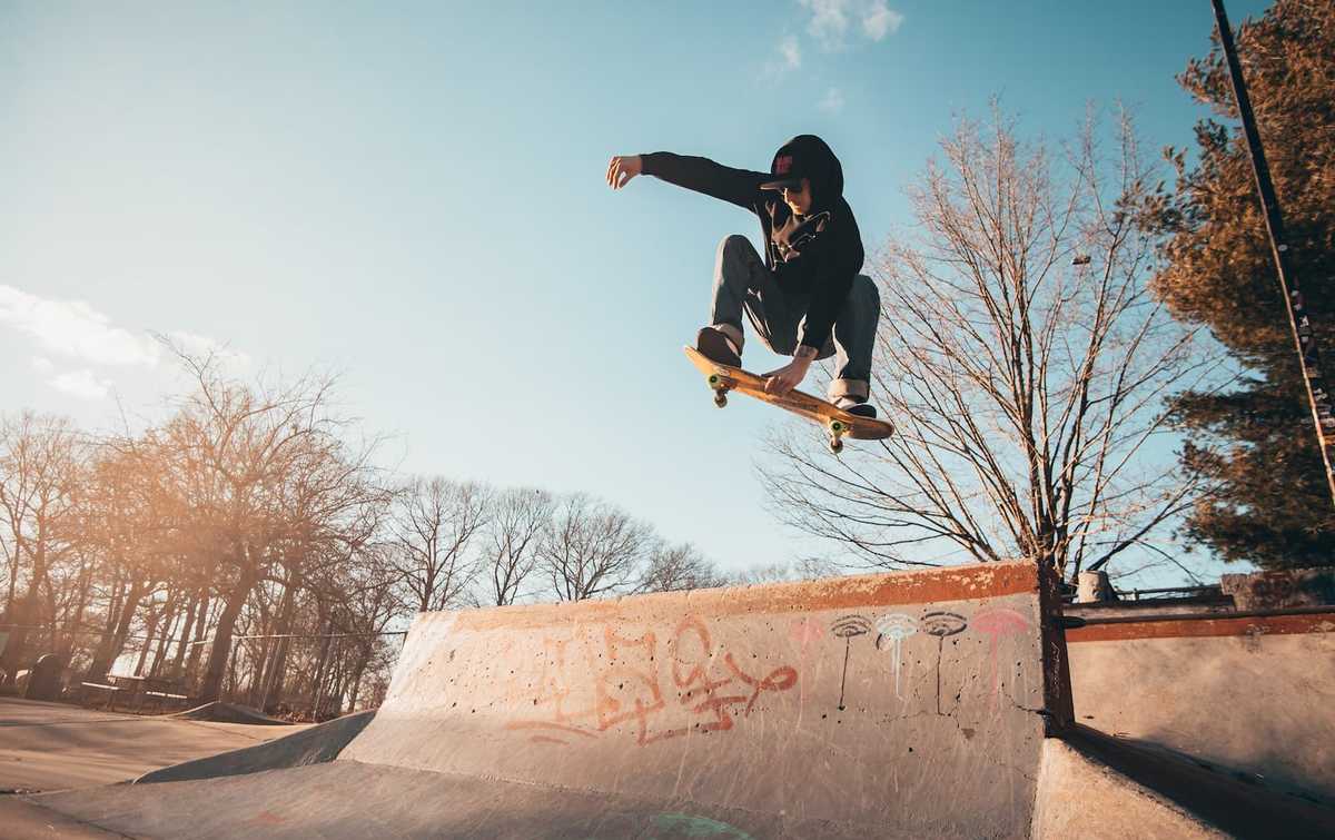 A skateboarder in mid air jump.